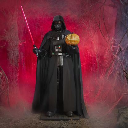 Darth Vader holding a pumpkin