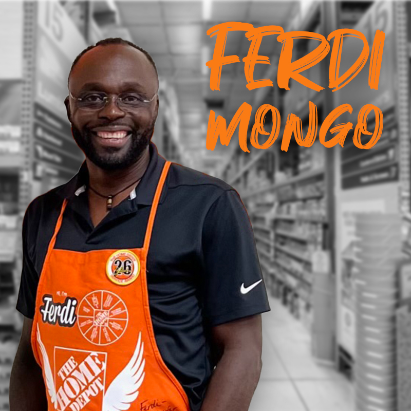 Picture of Ferdi Mongo in front of Home Depot aisles.