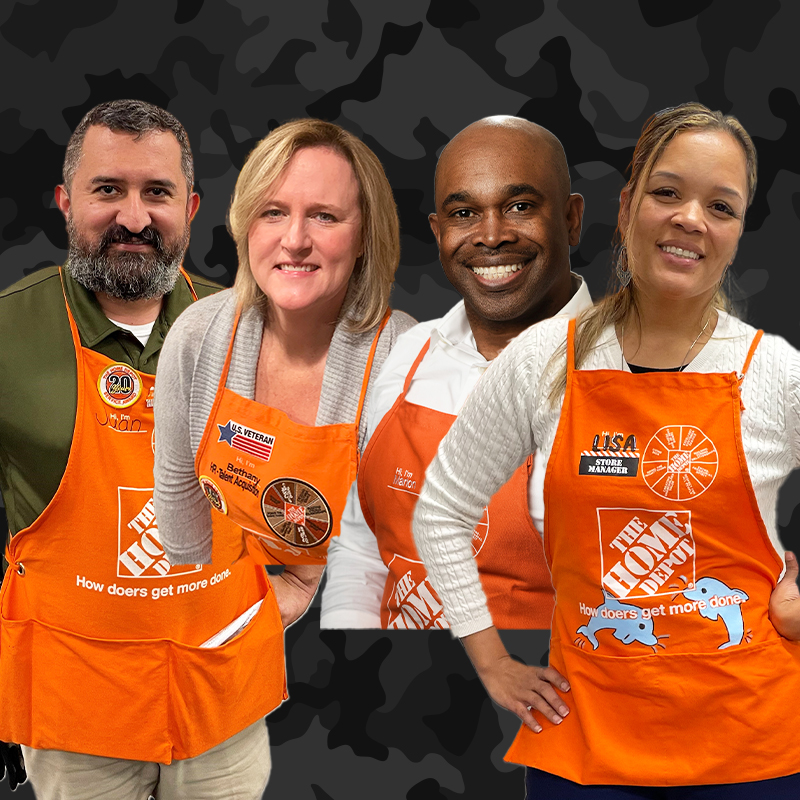 Four associates standing together next to Home Depot Military logo