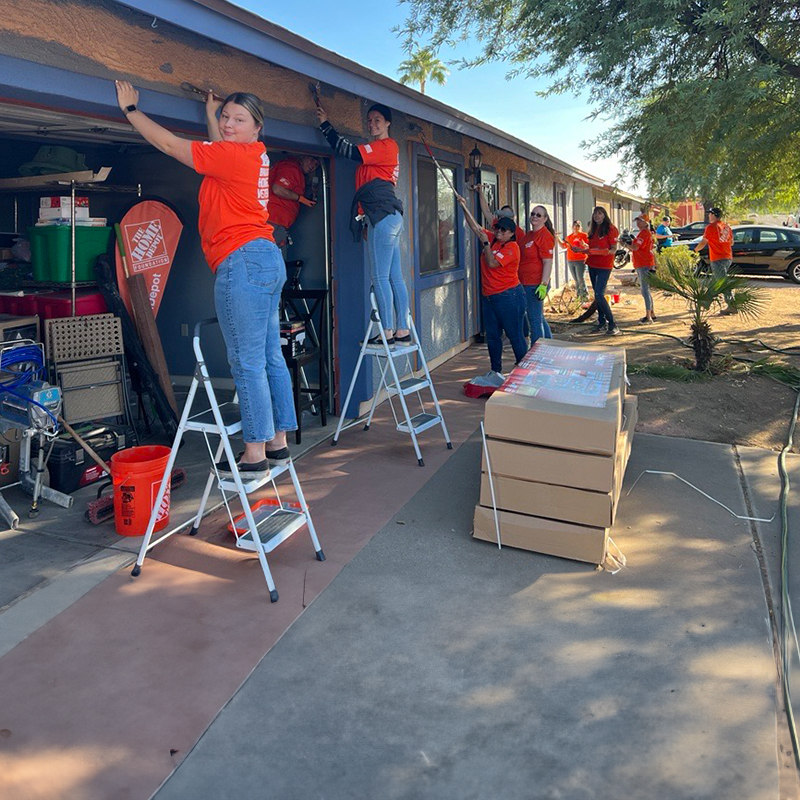 Team Depot volunteers working on a house