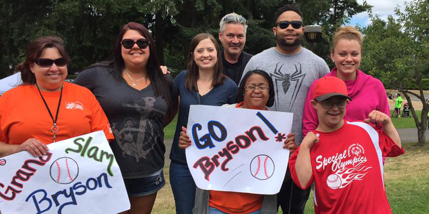 Home Depot associates cheering Bryson at at a baseball game.