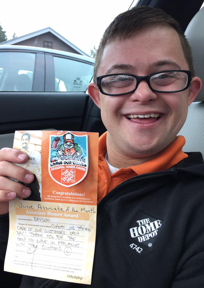 Bryson with June associate of the month award.
