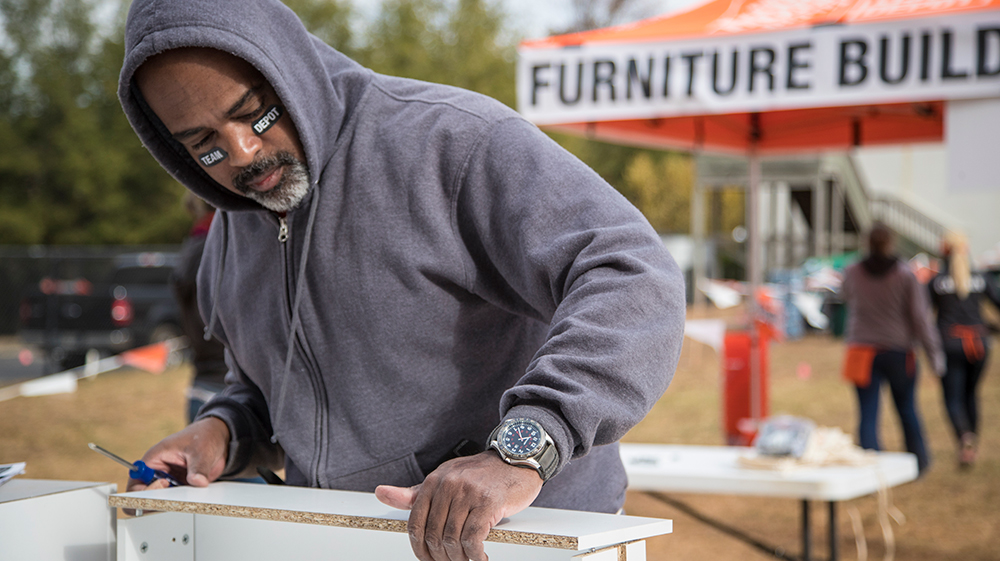 Home Depot volunteer assembling furniture