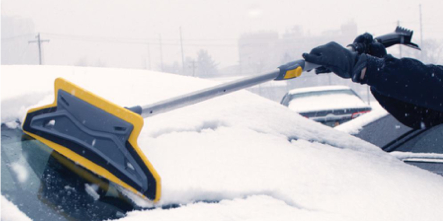 Ice scraper clearing car windshield