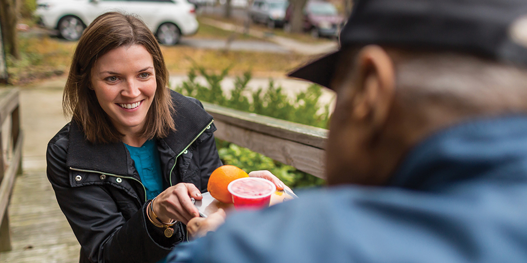 Volunteer delivering meals with Meals on Wheels America