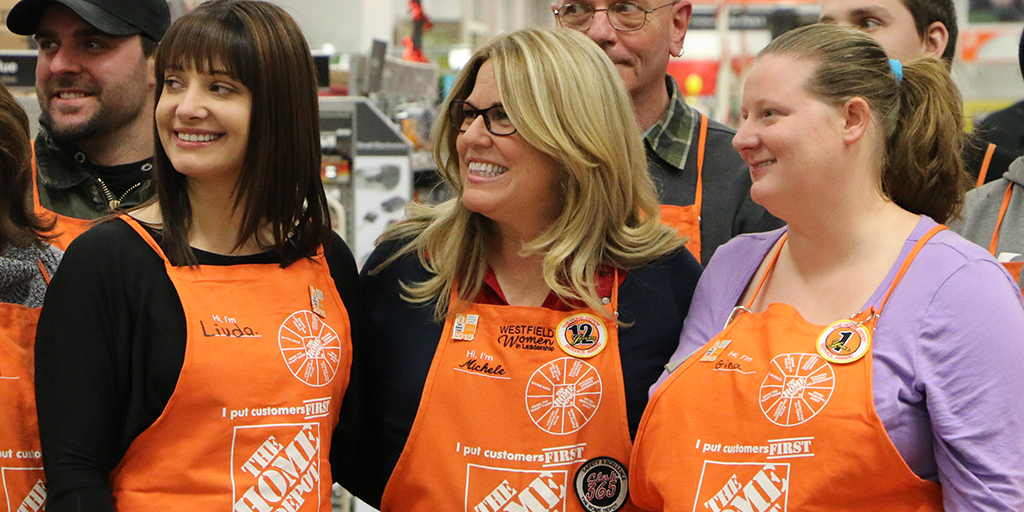 Home Depot associates smiling