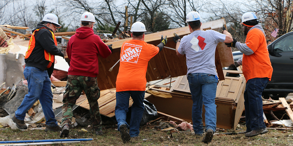 Team Depot and Team Rubicon volunteers clearing storm debris