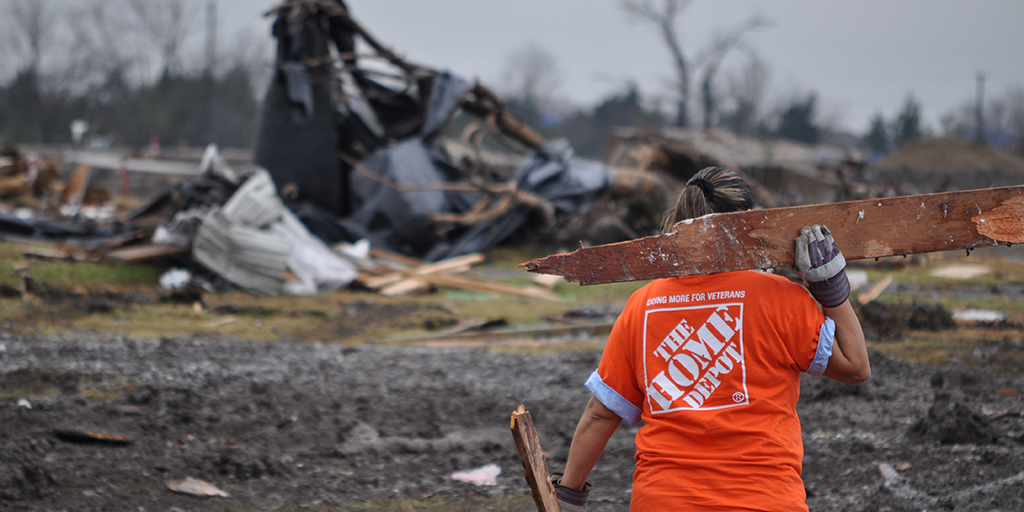 Home Depot volunteer clearing tornado debris