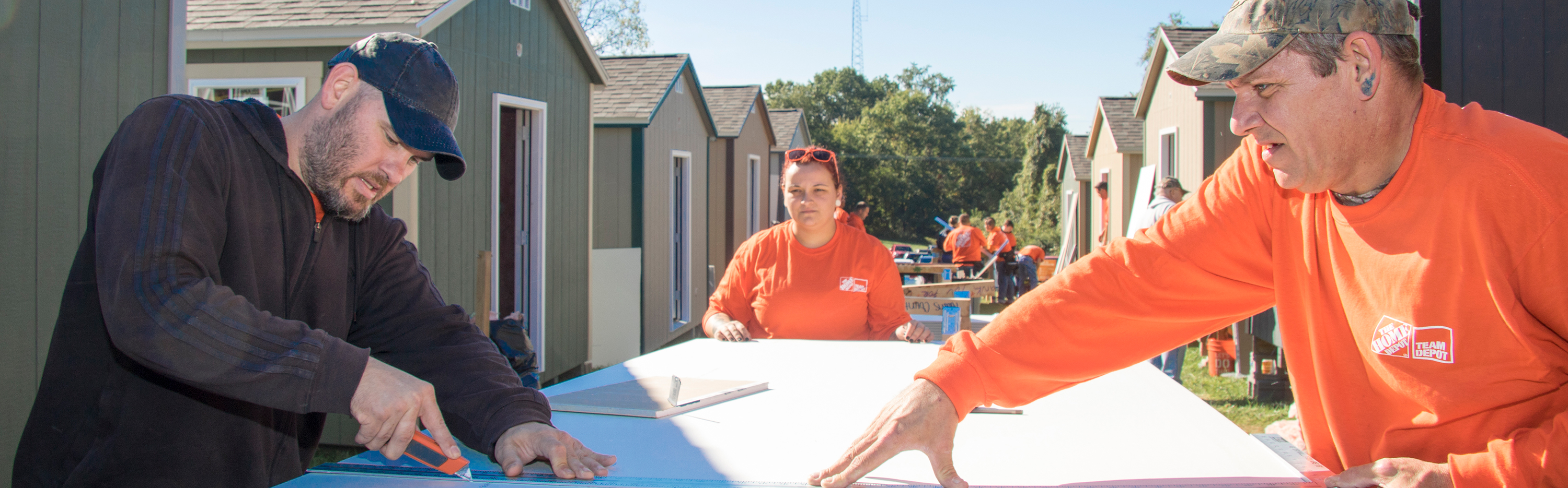 Team Depot volunteers measuring materials