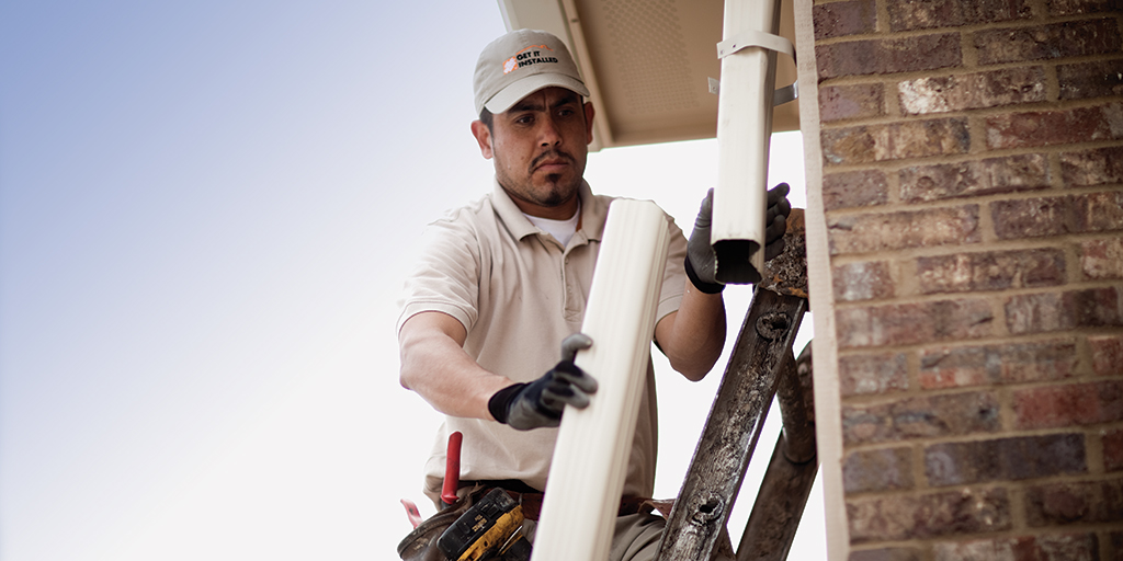 Man working on gutter