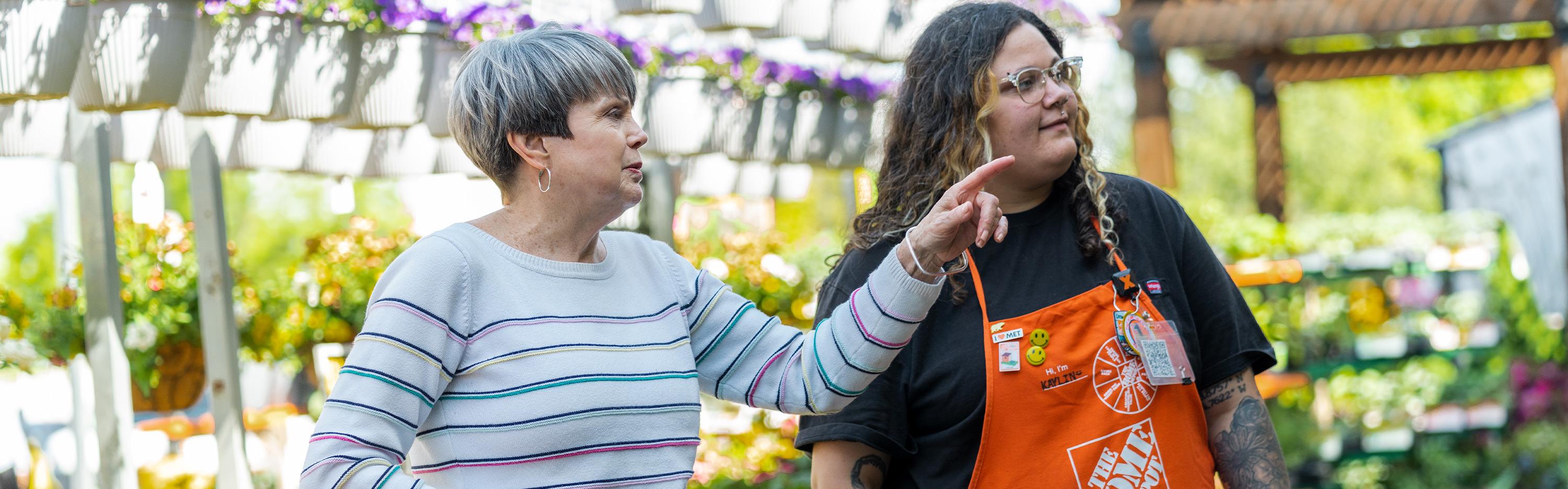 Associate and customer in the garden section