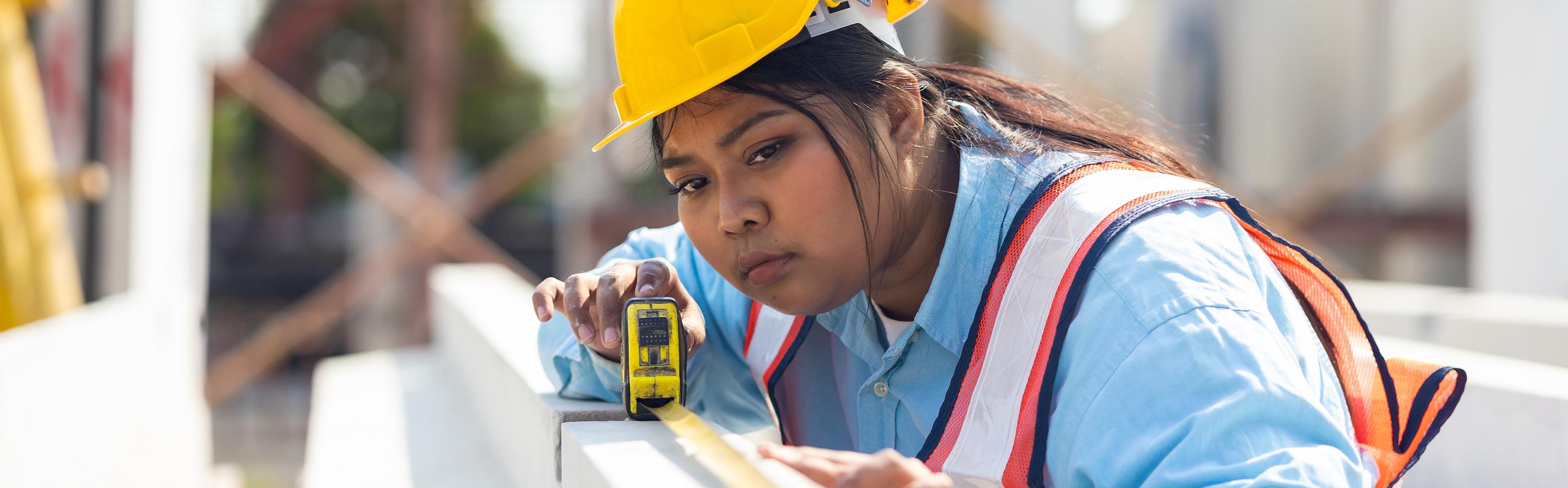 A woman using a tape measure