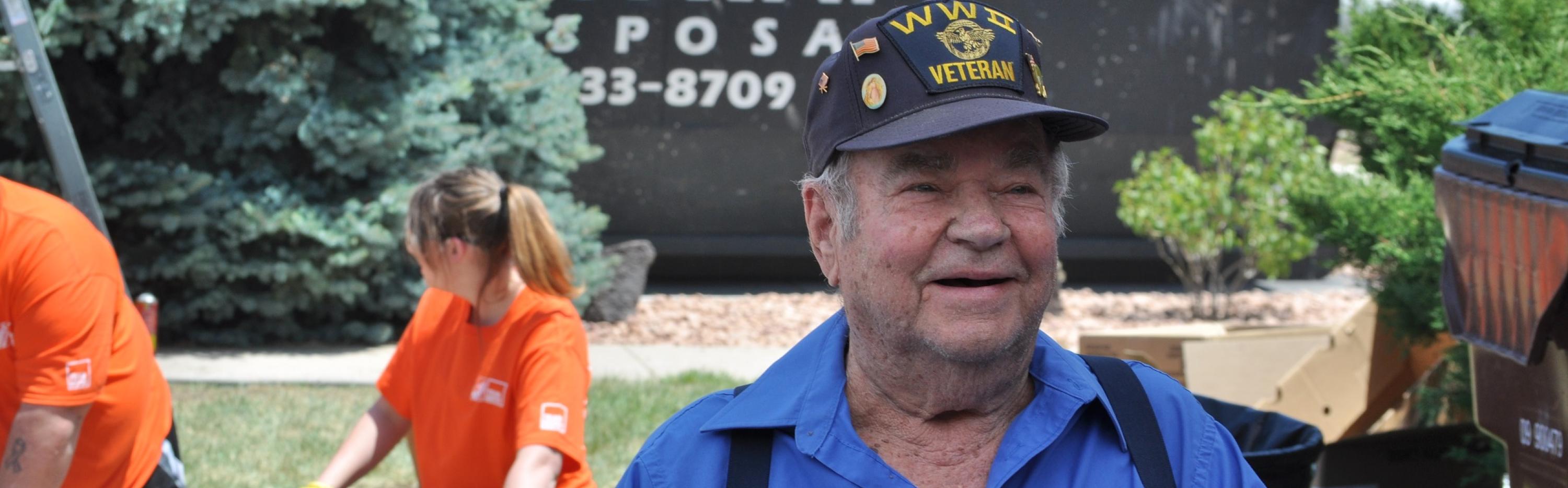 WWII veteran watches as Team Depot volunteers renovate his home