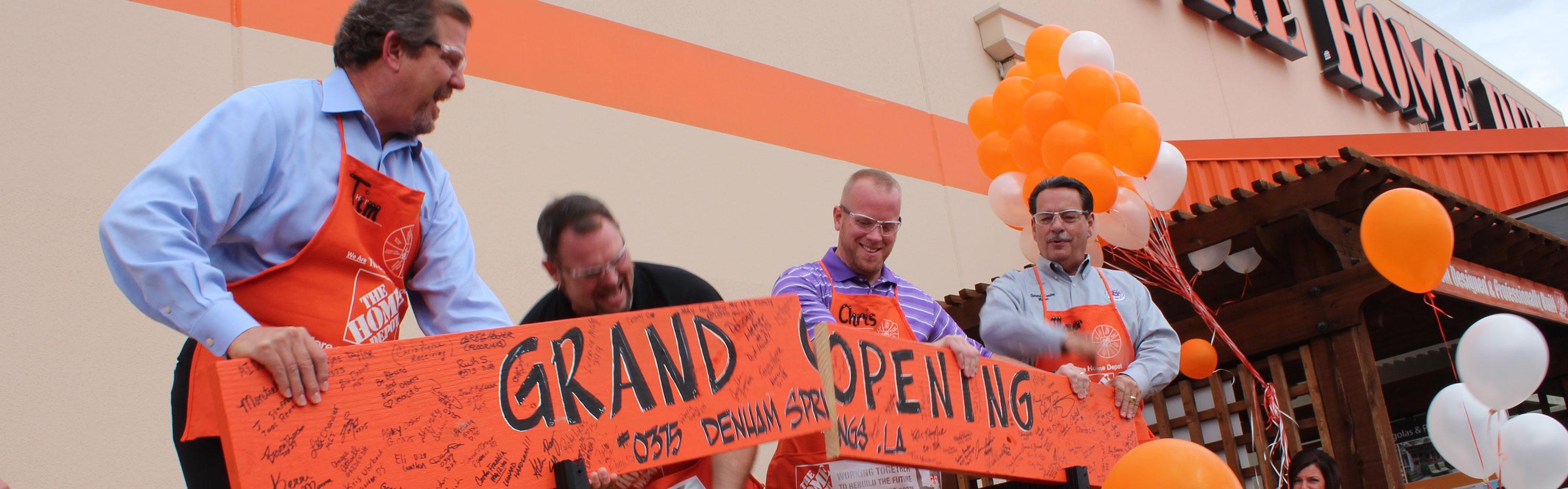Home Depot associates at board-cutting ceremony