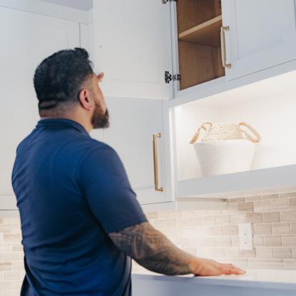 Maverick looking at his new laundry room