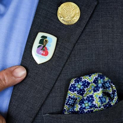 A FIFA World Cup pin on a blazer