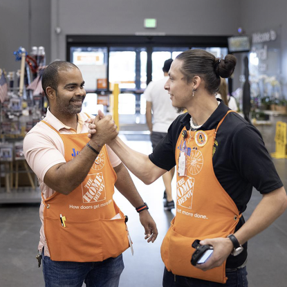 two associates shaking hands