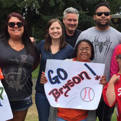 Home Depot associates cheering Bryson on at baseball game