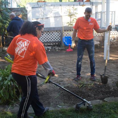 Team Depot volunteers at work in yard