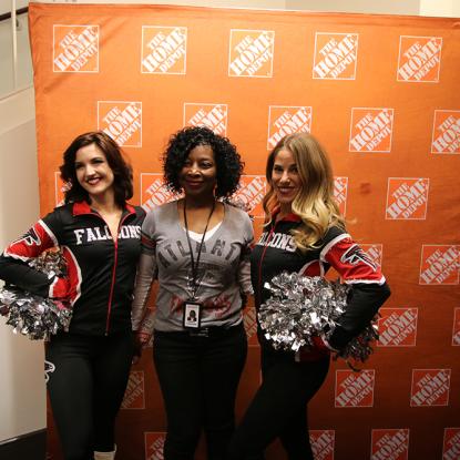 Home Depot associate with Falcons cheerleaders