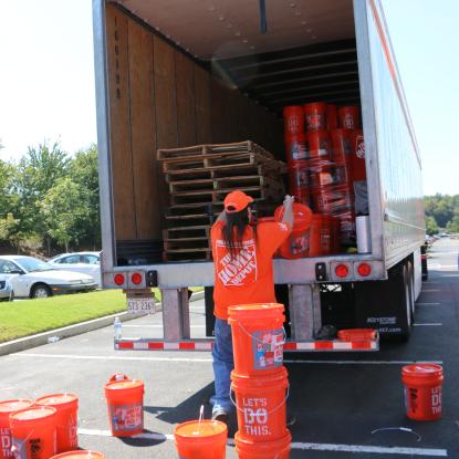 Volunteer packing truck with hurricane relief kits