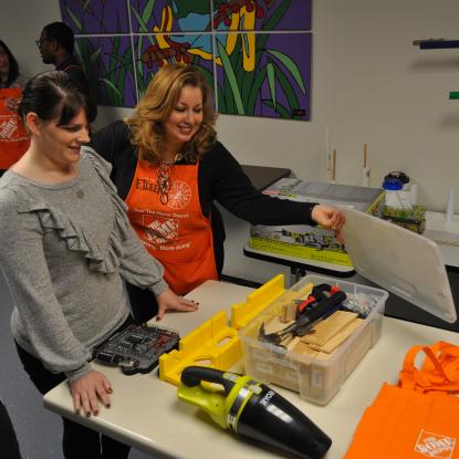 Home Depot associate showing tools in Tool Center