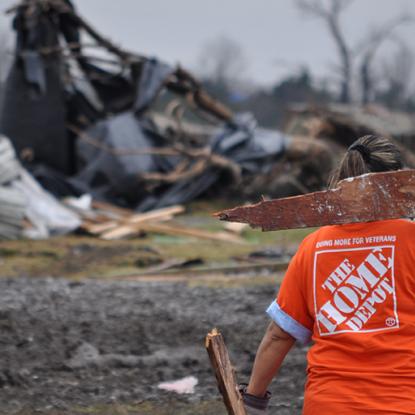 Home Depot volunteer clearing tornado debris
