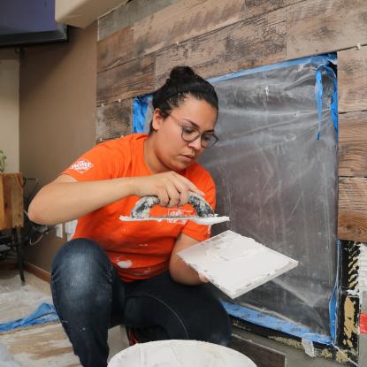 Team Depot volunteer at work renovating veteran family's home