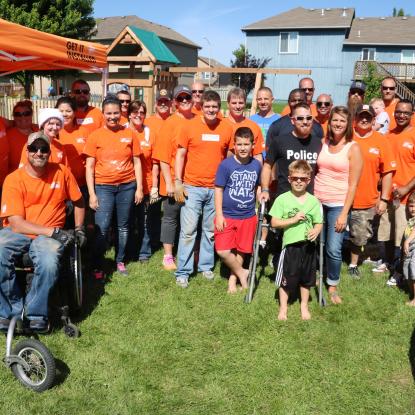Group photo with Team Depot volunteers and veteran family