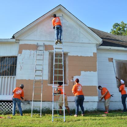 Team Depot volunteers paint house