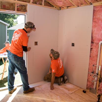 Team Depot volunteers working on tiny home