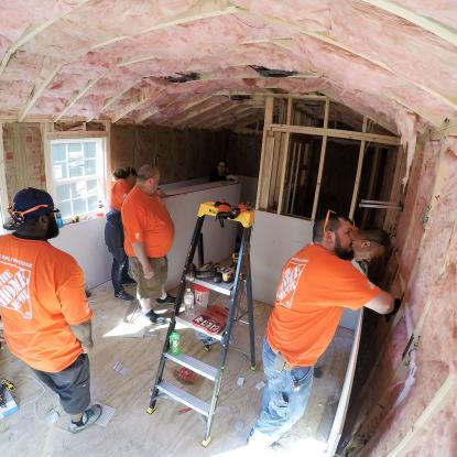 Team Depot volunteers building tiny homes