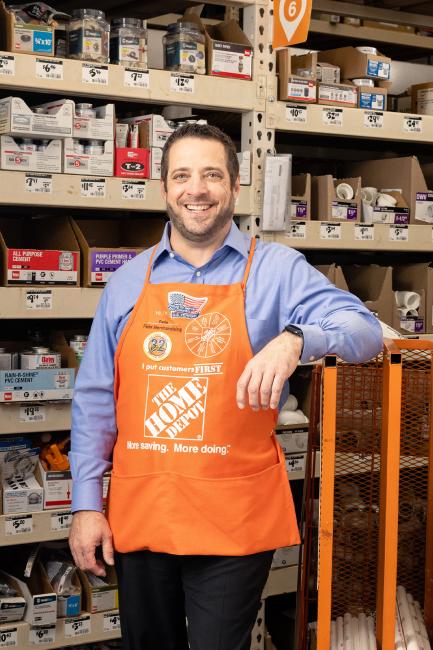 Pete Capel wearing orange apron