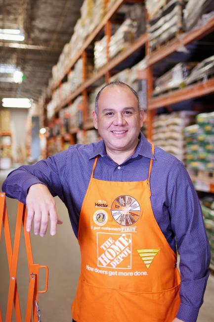Hector Padilla posing in a Home Depot store