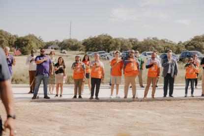 Team depot says the pledge of allegiance in front