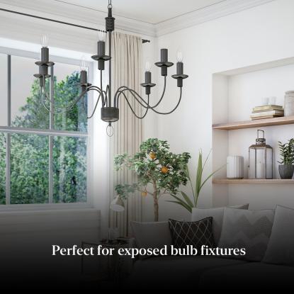 a living room with a lighting fixture hanging from the ceiling