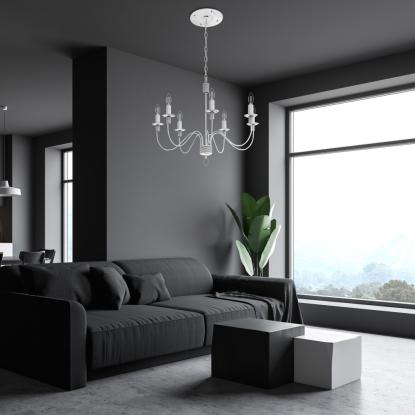 a living room with a lighting fixture hanging from the ceiling