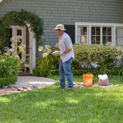 A man in a front lawn