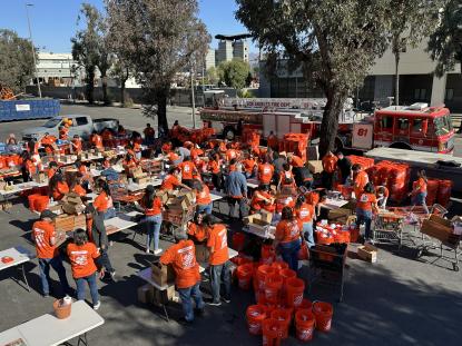 Team Depot Associates filling buckets for wildfire relief