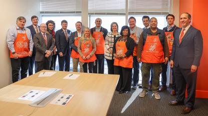 A group of Home Depot associates in aprons