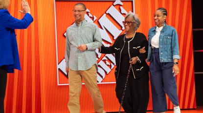 Leonard and family on stage at The Home Depot's Store Managers' Meeting