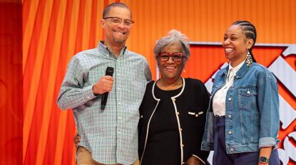Leonard and family on stage at The Home Depot's Store Managers' Meeting