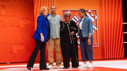 Leonard and family on stage with Crystal Hanlon at The Home Depot's Store Managers' Meeting