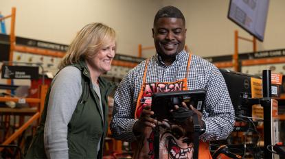 Two Home Depot associates looking at an iPad